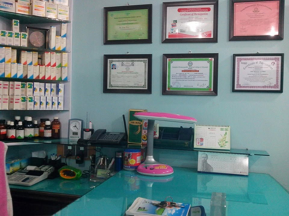 Homeopathic dispensary and framed credentials at the clinic